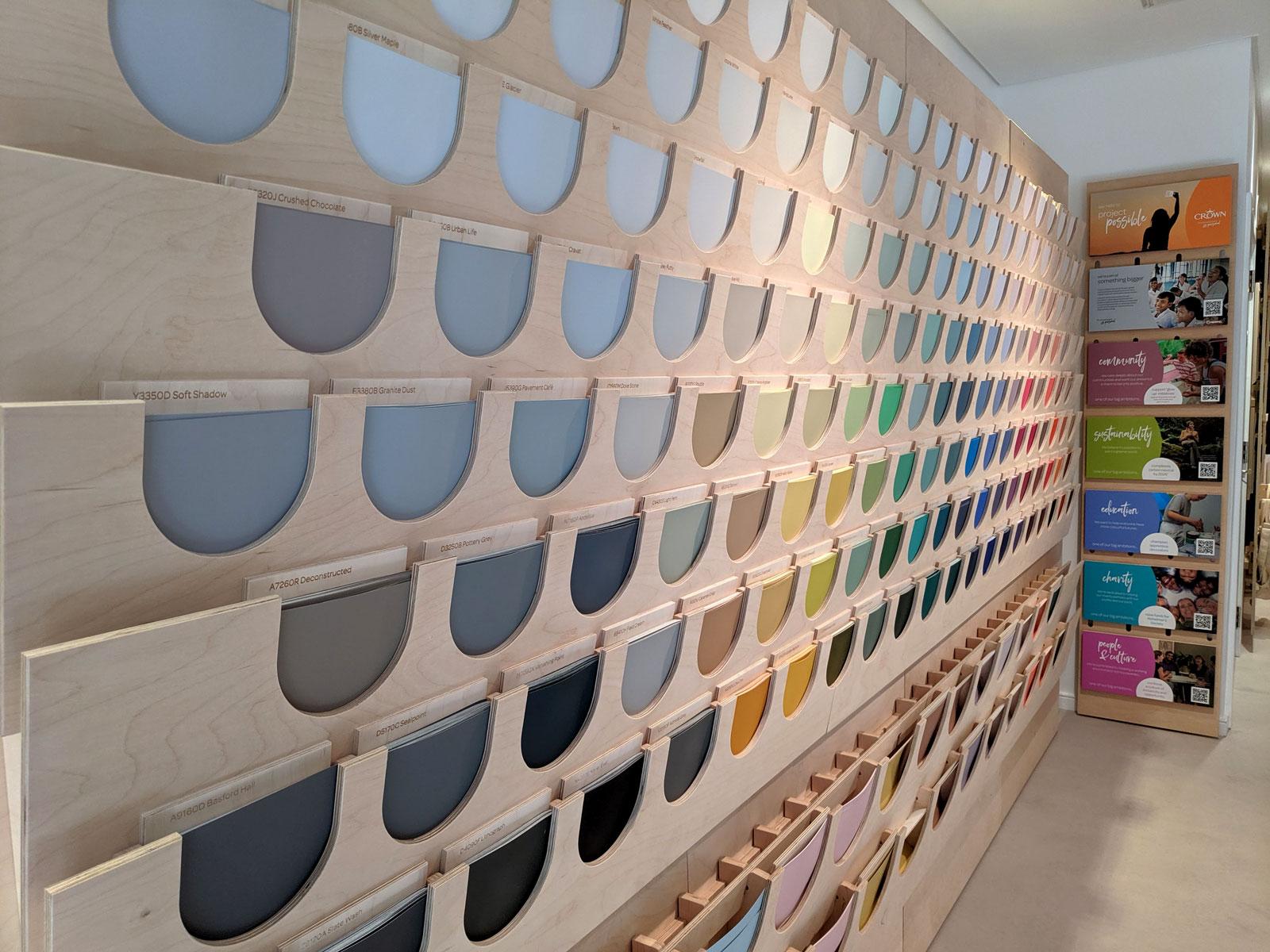 Photograph of a wall of Crown paint samples at Material Source in Glasgow.