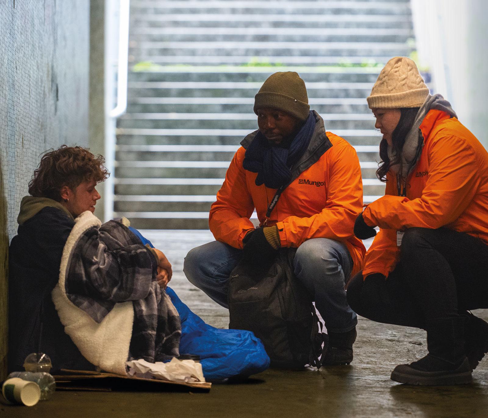 Photograph of a homeless person being helped by staff at St Mungo's